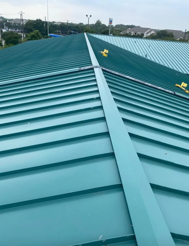 Green commercial metal roof ridge and valley for Metal Roof Repair in Essex Junction
