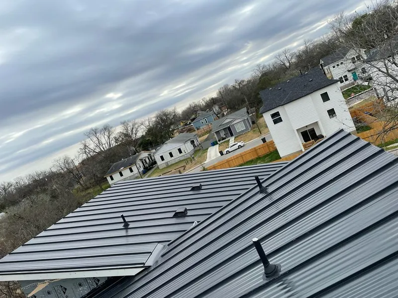 Standing seam metal roof panels with vents for Skylight Repair in Essex Junction